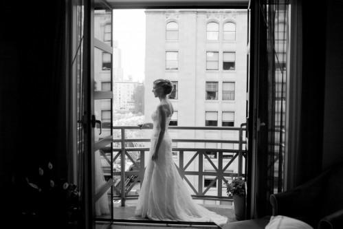 Beautiful bride overlooking Park Avenue South from a Balcony King Guestroom. Photo courtesy of Jennifer Davis Photography