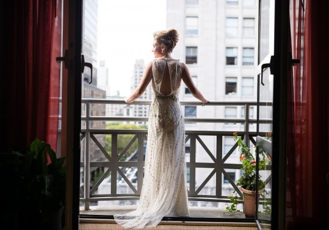 Bride posing on juliet balcony