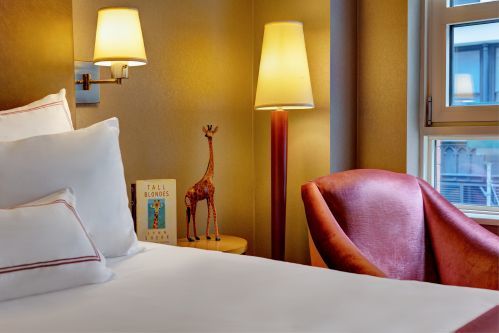 Each guestroom features a rose colored velveteen arm chair, they are perfect to curl up on and read a book!